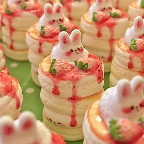 a tray of pink bunny-like desserts