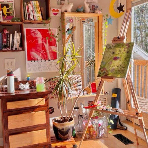 the corner of someone's art studio at sunset